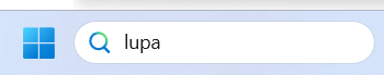 Pole wyszukiwarki w pasku zadań. W polu wpisane słowo: lupa.